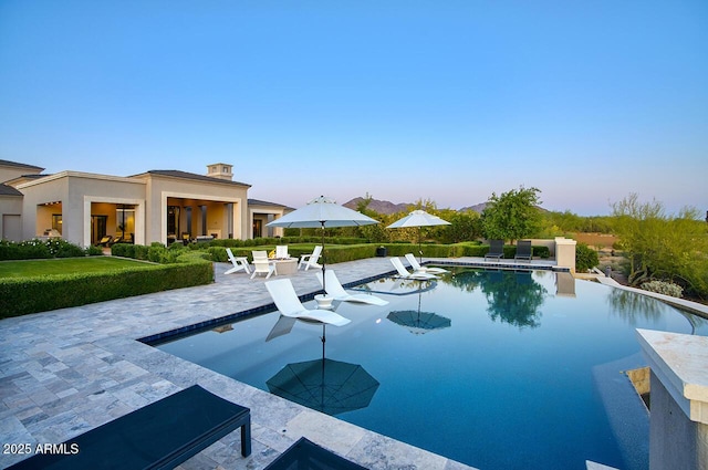 pool with a patio area