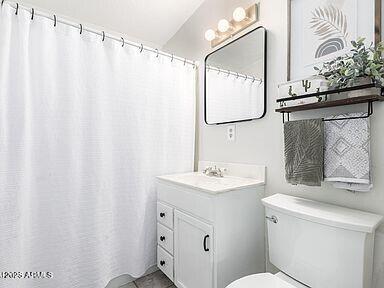 bathroom with vanity and toilet