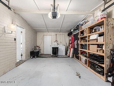 storage room with a garage and separate washer and dryer