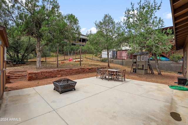 view of patio / terrace with an outdoor fire pit