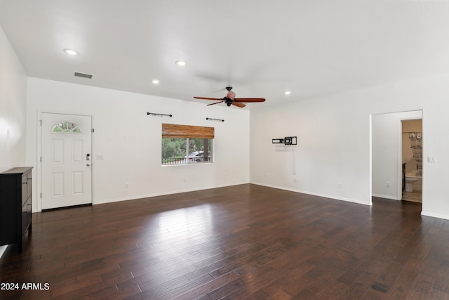 unfurnished living room featuring dark hardwood / wood-style flooring and ceiling fan