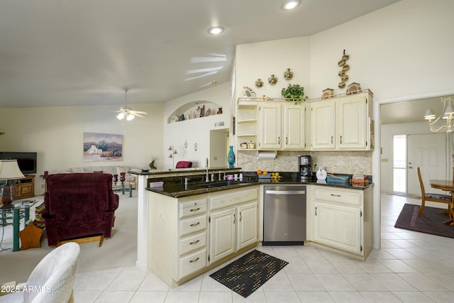 kitchen with light tile patterned floors, stainless steel dishwasher, and cream cabinets