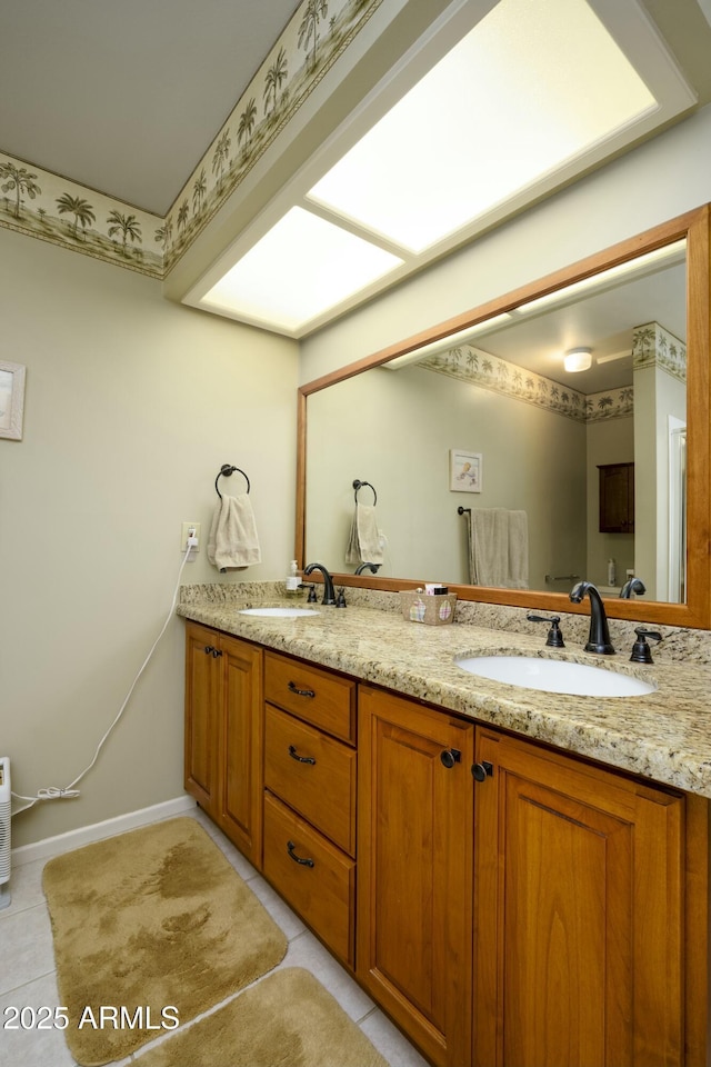 bathroom featuring tile patterned flooring and vanity