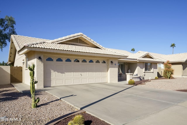 ranch-style house featuring a garage