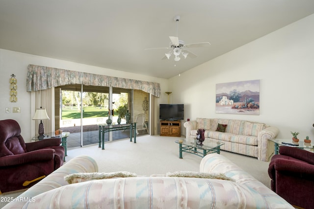 living room with ceiling fan, carpet, and vaulted ceiling