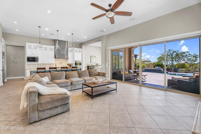 37308 N 100th Pl, Scottsdale, AZ 85262 - living area featuring light tile patterned floors, a towering ceiling, a ceiling fan, and recessed lighting