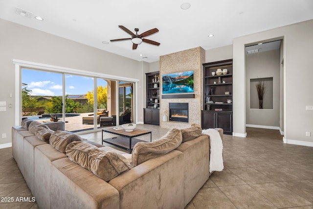 37308 N 100th Pl, Scottsdale, AZ 85262 - living area featuring baseboards, visible vents, built in shelves, and ceiling fan