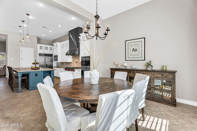 37308 N 100th Pl, Scottsdale, AZ 85262 - dining space featuring a chandelier, baseboards, light tile patterned flooring, recessed lighting, and a high ceiling