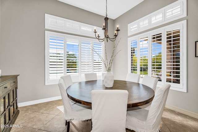 37308 N 100th Pl, Scottsdale, AZ 85262 - dining space with light tile patterned floors, a chandelier, and baseboards