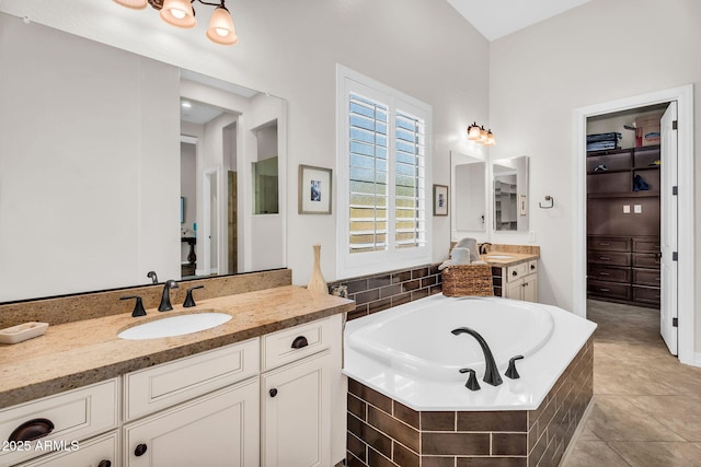 37308 N 100th Pl, Scottsdale, AZ 85262 - bathroom with a garden tub, two vanities, a sink, and tile patterned floors