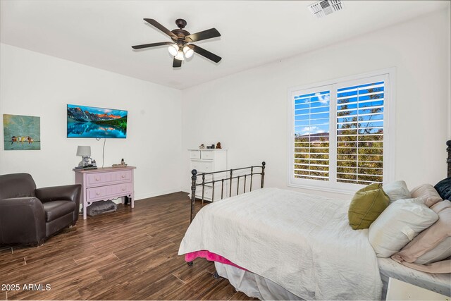 37308 N 100th Pl, Scottsdale, AZ 85262 - bedroom featuring wood finished floors, visible vents, a ceiling fan, and baseboards