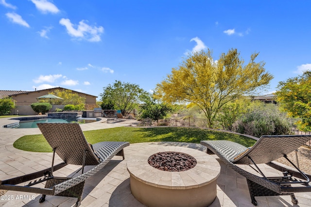 37308 N 100th Pl, Scottsdale, AZ 85262 - view of patio with an outdoor fire pit, fence, and a fenced in pool