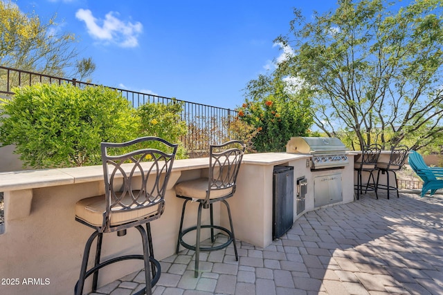 37308 N 100th Pl, Scottsdale, AZ 85262 - view of patio featuring outdoor dry bar, area for grilling, and exterior kitchen