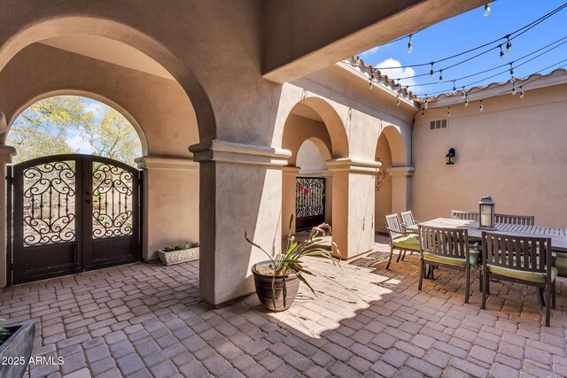 37308 N 100th Pl, Scottsdale, AZ 85262 - view of patio / terrace with a gate, visible vents, and outdoor dining area