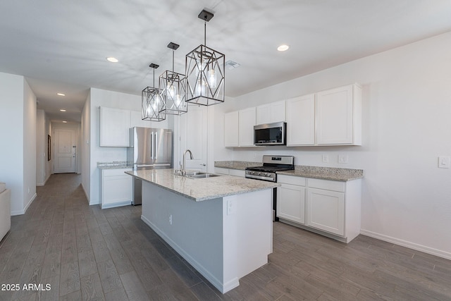 6117 S Adelle, Mesa, AZ 85212 - kitchen featuring dark wood-type flooring, a sink, appliances with stainless steel finishes, and an island with sink