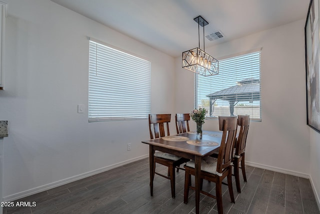 6117 S Adelle, Mesa, AZ 85212 - dining room with visible vents, dark wood-style flooring, baseboards, and a notable chandelier