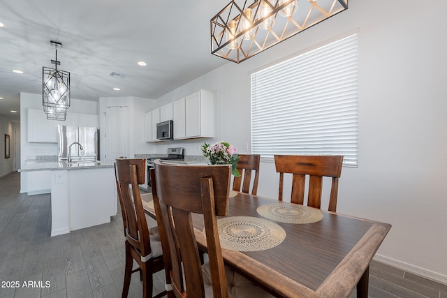 6117 S Adelle, Mesa, AZ 85212 - dining space featuring visible vents, dark wood-style flooring, baseboards, recessed lighting, and a chandelier