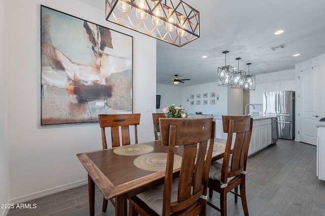 6117 S Adelle, Mesa, AZ 85212 - dining space with visible vents, dark wood finished floors, baseboards, ceiling fan with notable chandelier, and recessed lighting