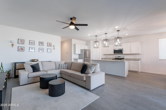 6117 S Adelle, Mesa, AZ 85212 - living area with baseboards, ceiling fan, recessed lighting, and wood finished floors