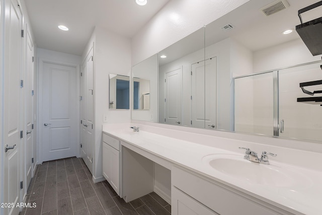 6117 S Adelle, Mesa, AZ 85212 - bathroom featuring visible vents, double vanity, recessed lighting, a sink, and a stall shower