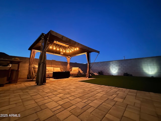 6117 S Adelle, Mesa, AZ 85212 - patio at twilight with a fenced backyard, a gazebo, and an outdoor living space