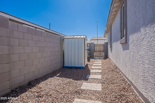 6117 S Adelle, Mesa, AZ 85212 - view of yard with an outdoor structure, a shed, and fence