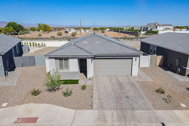 6117 S Adelle, Mesa, AZ 85212 - single story home featuring a garage, stucco siding, a gate, a tiled roof, and driveway