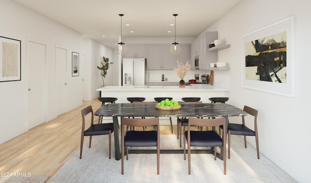 dining area featuring light wood-type flooring