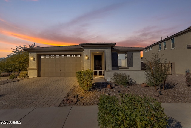 view of front of property with a garage