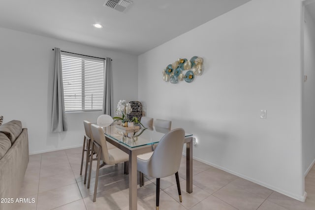 dining area featuring light tile patterned flooring