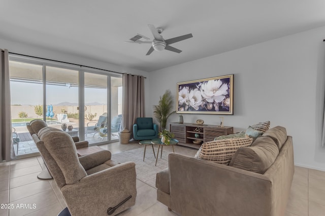 tiled living room featuring ceiling fan