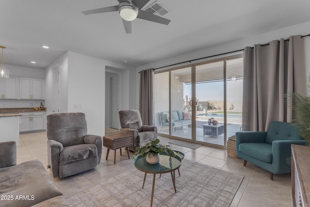 tiled living room featuring ceiling fan