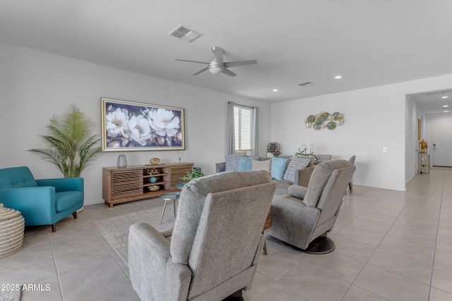 tiled living room with ceiling fan