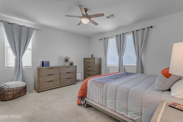 bedroom with light colored carpet and ceiling fan