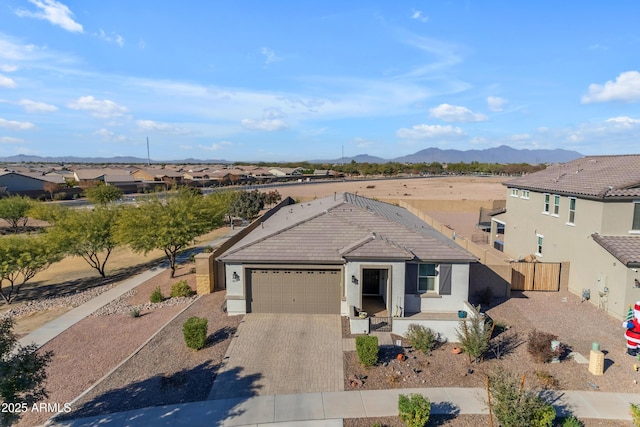 view of front of home featuring a mountain view and a garage