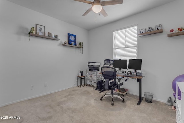 carpeted office featuring ceiling fan