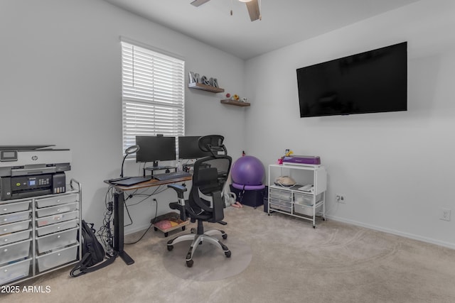 carpeted office featuring ceiling fan