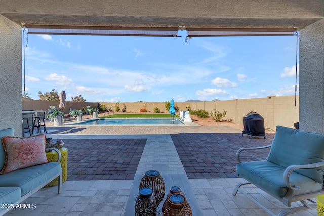 view of patio featuring a fenced in pool