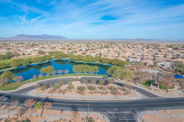 aerial view featuring a water and mountain view