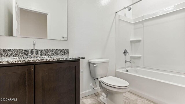 bathroom featuring shower / washtub combination, baseboards, vanity, and toilet