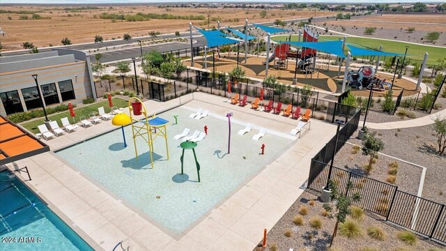 view of pool featuring fence