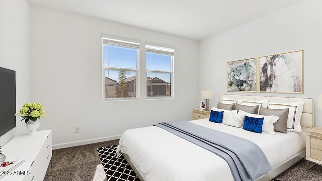 bedroom with baseboards and dark colored carpet