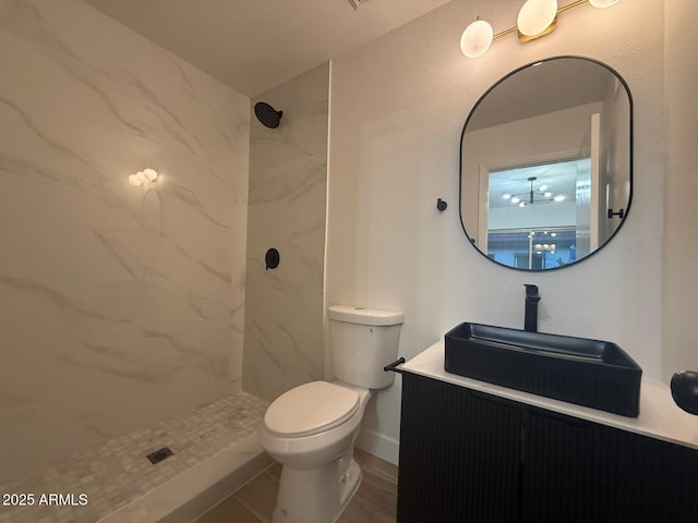 full bathroom with a shower, toilet, and vanity