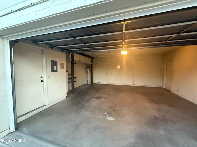 garage featuring water heater and electric panel