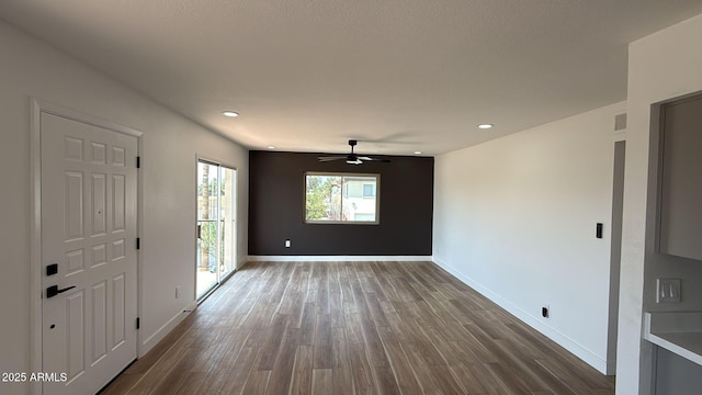 entrance foyer featuring dark wood-style flooring, ceiling fan, baseboards, and recessed lighting