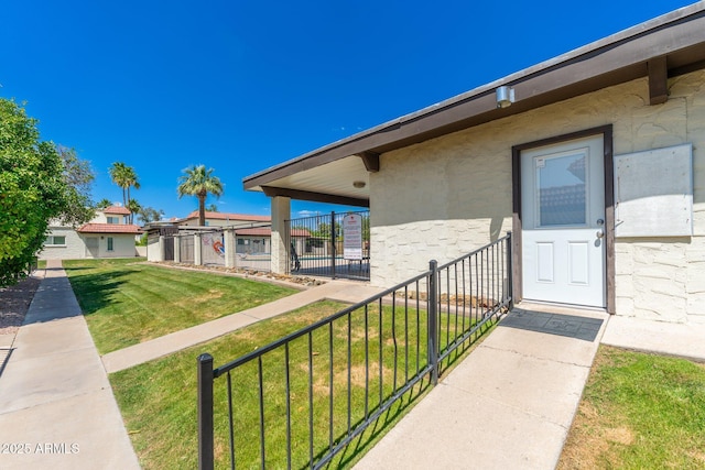 view of exterior entry featuring stucco siding and stone siding