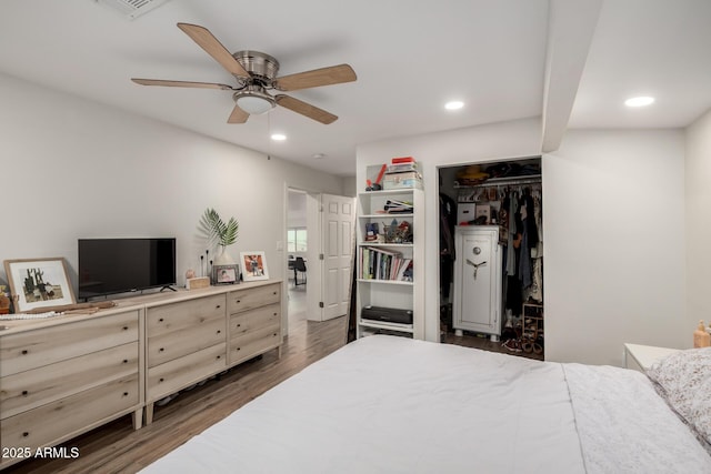 bedroom featuring a closet, recessed lighting, and wood finished floors