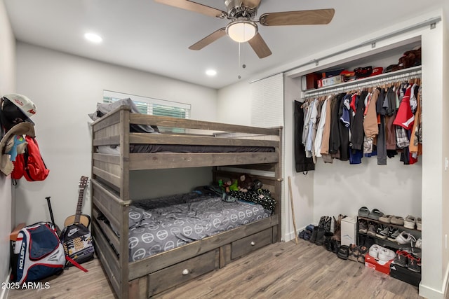 bedroom with recessed lighting, wood finished floors, a closet, and ceiling fan