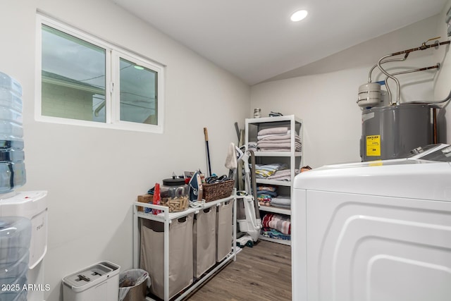 laundry area with laundry area, recessed lighting, electric water heater, and wood finished floors