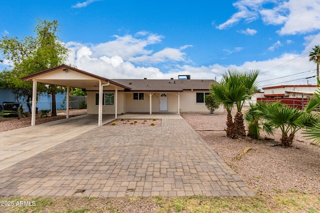2130 W Colter St, Phoenix, AZ 85015 - rear view of house featuring decorative driveway and a carport